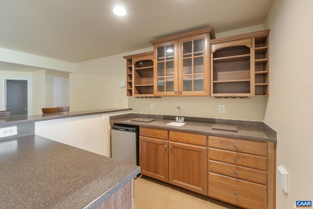 kitchen featuring stainless steel dishwasher and sink