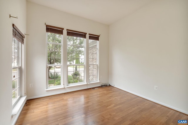 spare room featuring light hardwood / wood-style flooring