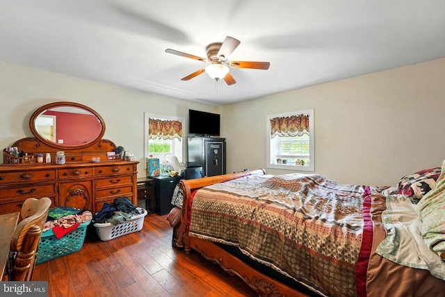  - bedroom with wood-type flooring and ceiling fan