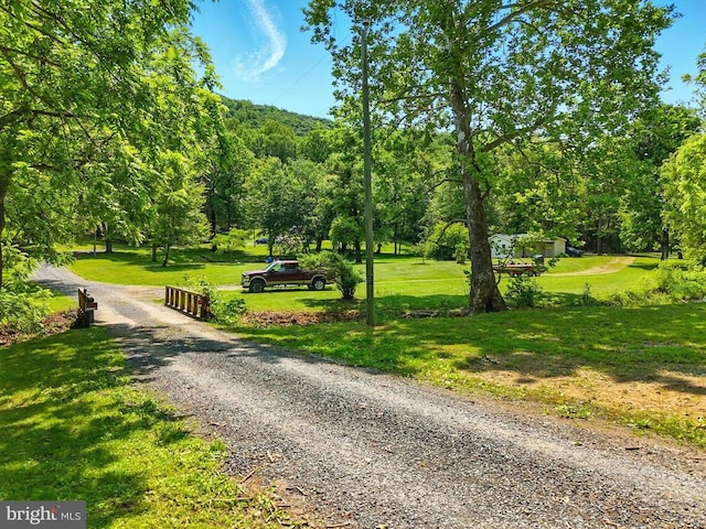  - view of home's community featuring a lawn