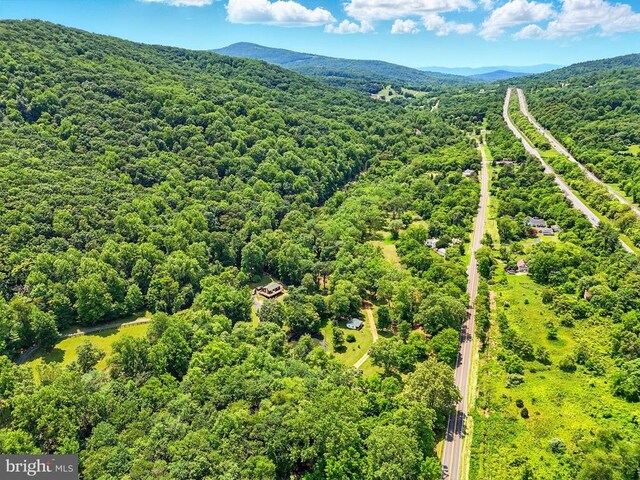  - aerial view of a heavily wooded area and mountains