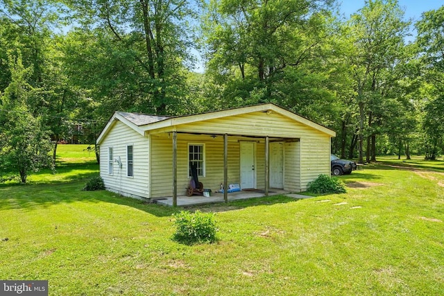  - view of front facade featuring a front lawn and a porch