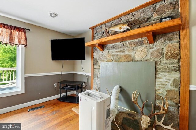  - living room featuring wood finished floors and baseboards