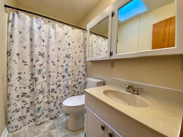 1655 Howardsville Tpke, Stuarts Draft, VA 24477 - full bath featuring toilet, vanity, and curtained shower