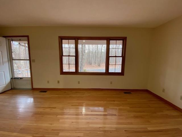 1655 Howardsville Tpke, Stuarts Draft, VA 24477 - spare room featuring light wood-style flooring and baseboards