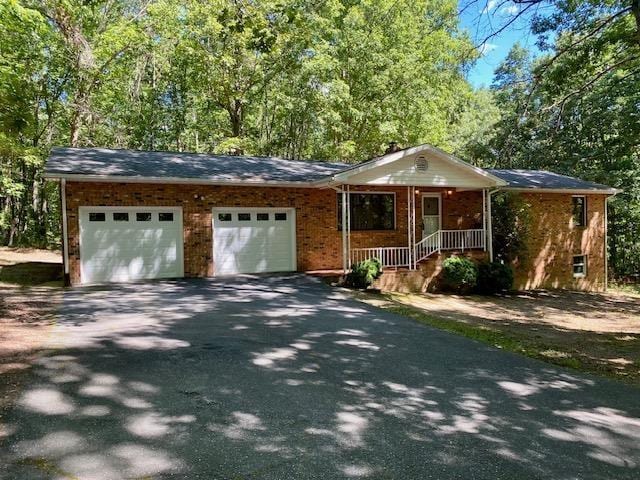 1655 Howardsville Tpke, Stuarts Draft, VA 24477 - single story home featuring aphalt driveway, an attached garage, and brick siding