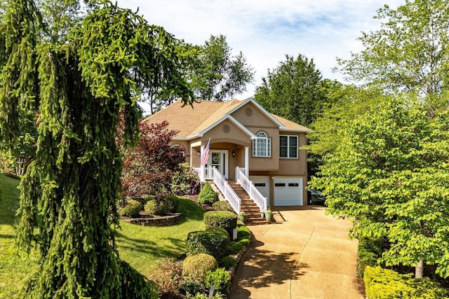 3953 Cavalry Ln, Penn Laird, VA 22846 - raised ranch with concrete driveway, stucco siding, a front lawn, an attached garage, and stairway