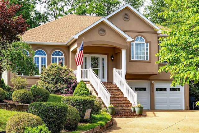 3953 Cavalry Ln, Penn Laird, VA 22846 - view of front of house featuring concrete driveway, stucco siding, a garage, and roof with shingles