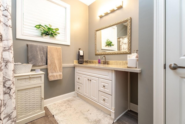 3953 Cavalry Ln, Penn Laird, VA 22846 - bathroom with baseboards, wood finished floors, and vanity
