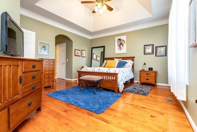 3953 Cavalry Ln, Penn Laird, VA 22846 - bedroom with arched walkways, light wood finished floors, a raised ceiling, ornamental molding, and baseboards