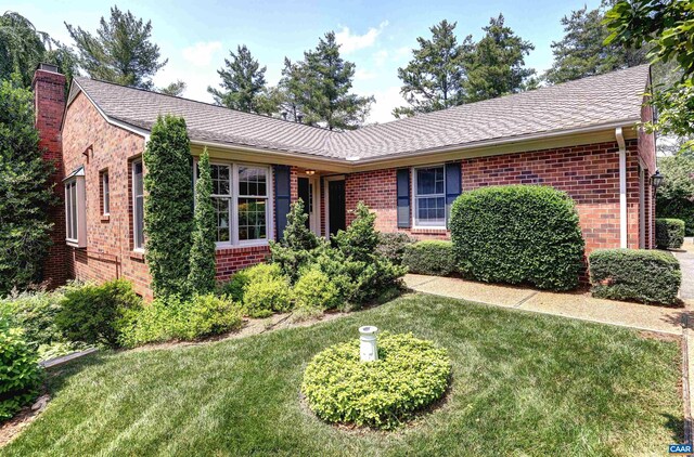560 Worthington Dr, Charlottesville, VA 22903 - view of front of property featuring brick siding, a shingled roof, a chimney, and a front lawn
