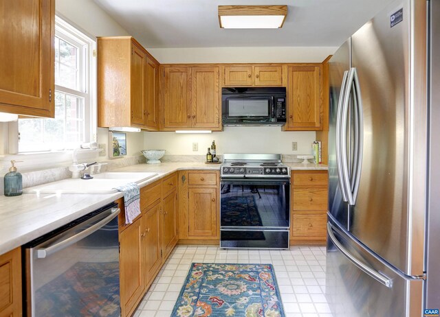 560 Worthington Dr, Charlottesville, VA 22903 - kitchen with stainless steel appliances, light countertops, and a sink