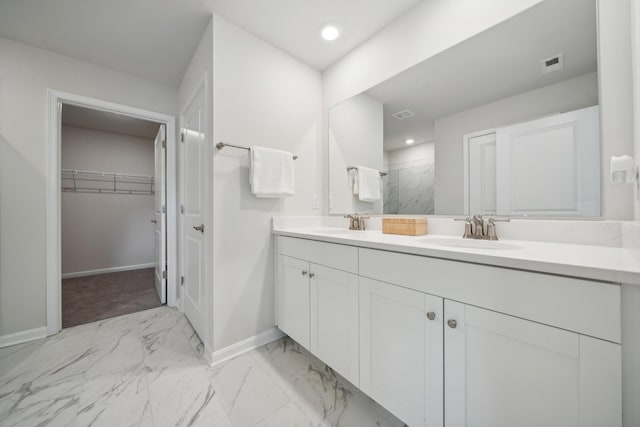 TBD Fairfield Dr, Staunton, VA 24401 - bathroom with baseboards, marble finish floors, double vanity, tiled shower, and a spacious closet