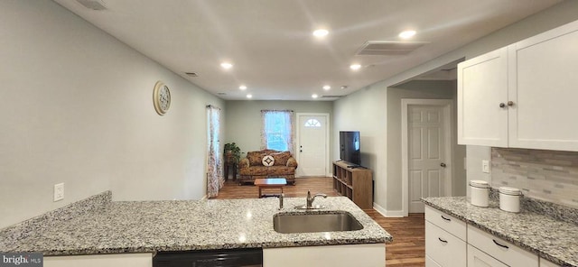 320 Third St, Fredericksburg, VA 22408 - kitchen featuring wood finished floors, white cabinetry, light stone countertops, backsplash, and recessed lighting