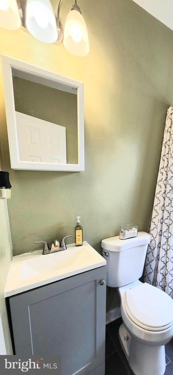320 Third St, Fredericksburg, VA 22408 - bathroom with vanity and tile patterned flooring
