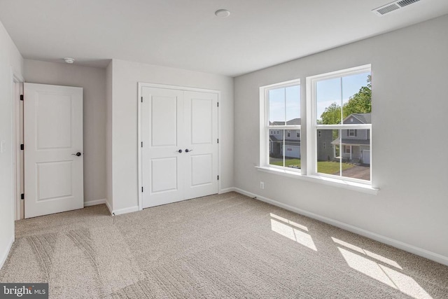 35607 Pine Needle Ln, Locust Grove, VA 22508 - unfurnished bedroom with carpet floors, baseboards, and a closet