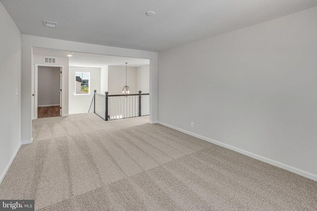 35607 Pine Needle Ln, Locust Grove, VA 22508 - carpeted empty room with a chandelier and baseboards