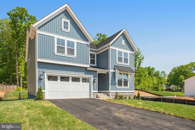 35607 Pine Needle Ln, Locust Grove, VA 22508 - view of front of property with board and batten siding, a garage, and asphalt driveway