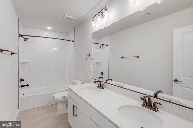 35607 Pine Needle Ln, Locust Grove, VA 22508 - full bathroom featuring toilet, double vanity, tile patterned floors, and tub / shower combination