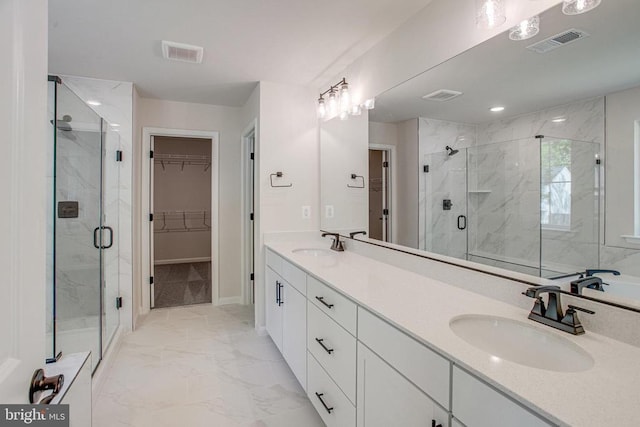 35607 Pine Needle Ln, Locust Grove, VA 22508 - full bath with a walk in closet, a marble finish shower, marble look tiles, and double vanity