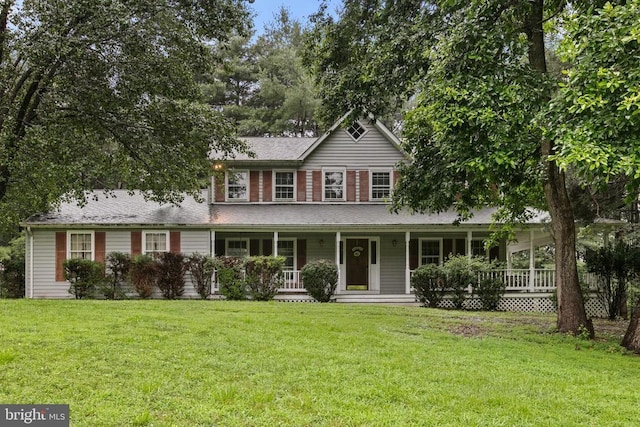  - view of front of property featuring a front yard and covered porch