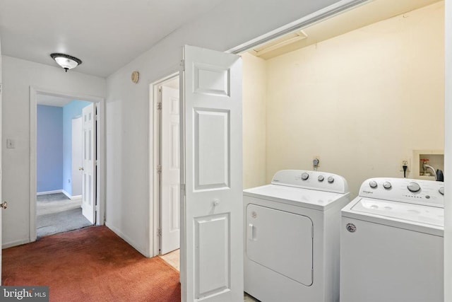 - laundry room featuring washing machine and clothes dryer and carpet floors