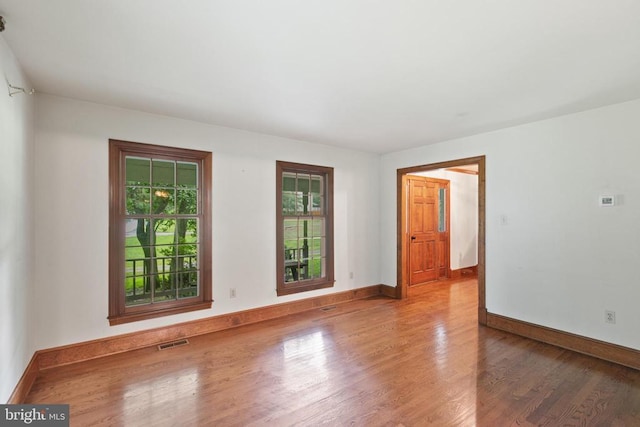  - spare room with wood finished floors and baseboards