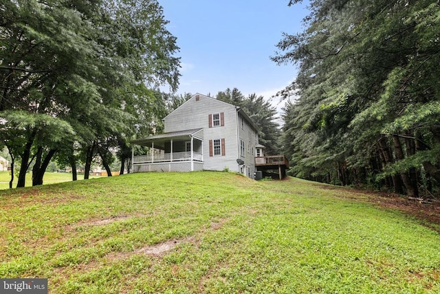  - rear view of house with a lawn and a porch