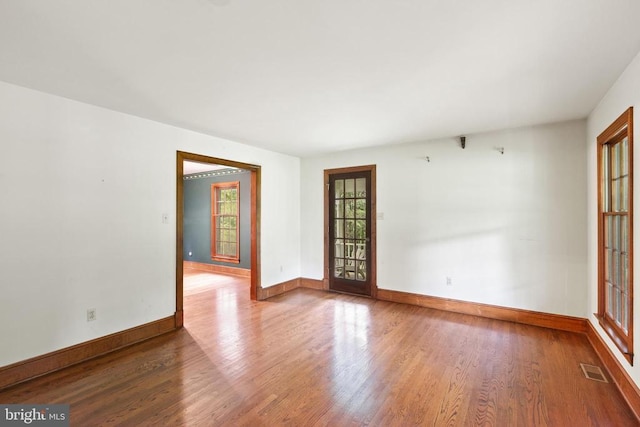  - spare room with wood finished floors