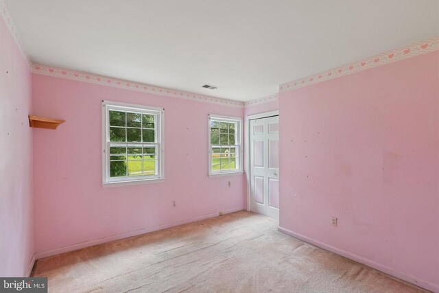  - carpeted spare room with baseboards