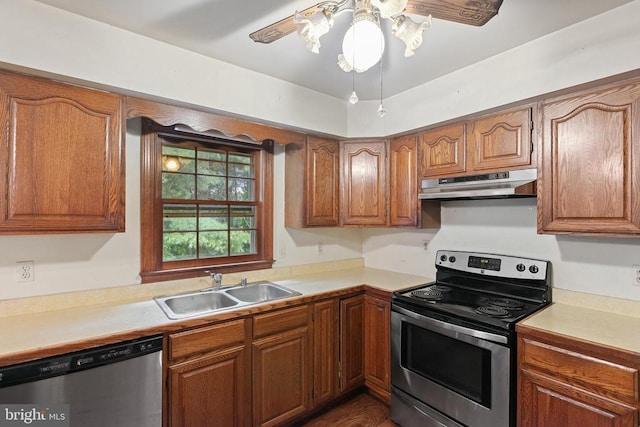  - kitchen featuring appliances with stainless steel finishes, under cabinet range hood, light countertops, brown cabinets, and a ceiling fan