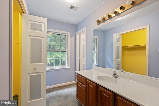  - bathroom with vanity and baseboards