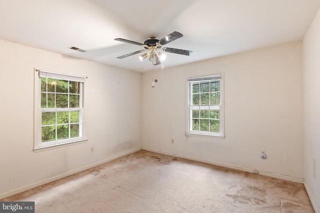  - carpeted spare room featuring baseboards and ceiling fan