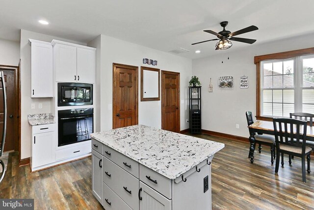  - kitchen featuring black appliances, a kitchen island, a ceiling fan, dark wood-style flooring, and recessed lighting