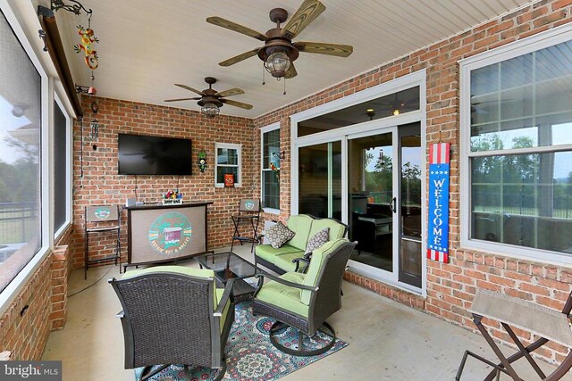  - view of patio / terrace featuring ceiling fan and outdoor lounge area