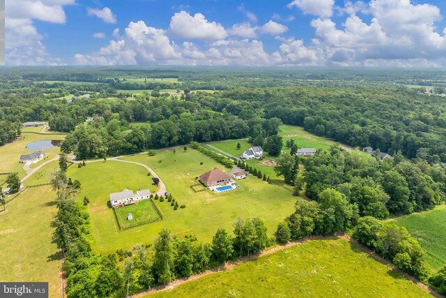  - overview of rural landscape featuring a heavily wooded area