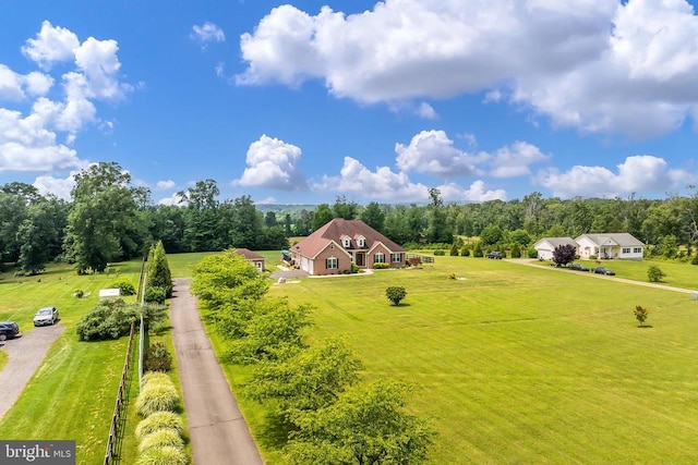 - view from above of property with a tree filled landscape