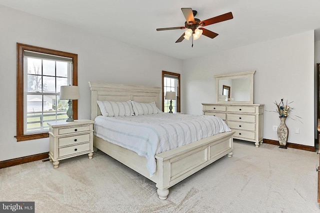  - bedroom with light carpet and ceiling fan