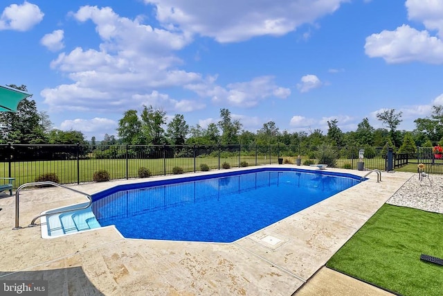  - view of swimming pool featuring a patio area