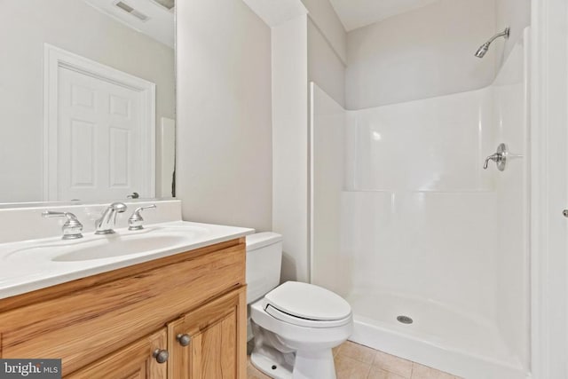 full bath featuring a shower, tile patterned flooring, toilet, and vanity