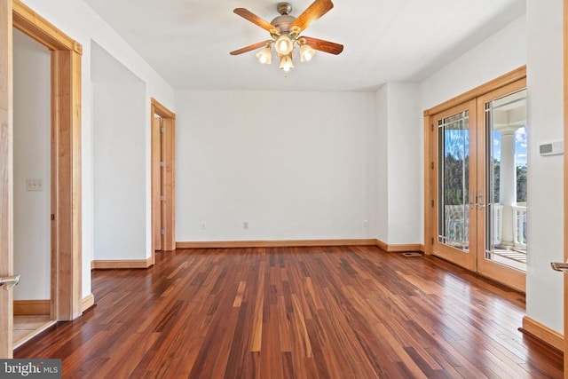 empty room with hardwood / wood-style flooring, ceiling fan, and baseboards