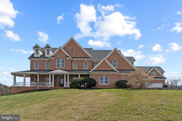 view of front facade with brick siding, covered porch, and a front lawn