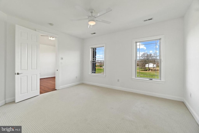 unfurnished bedroom with carpet floors, baseboards, and ceiling fan
