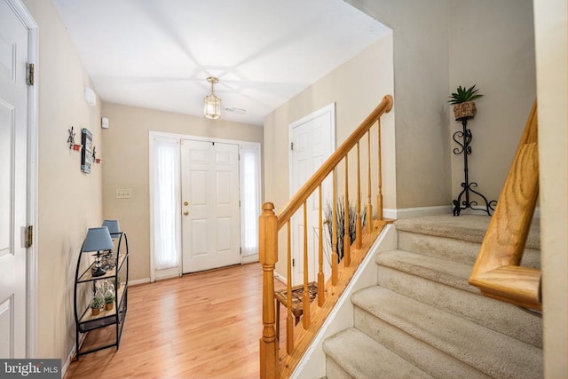 7207 Finch Ln, Fredericksburg, VA 22407 - foyer featuring light wood finished floors, stairs, and baseboards