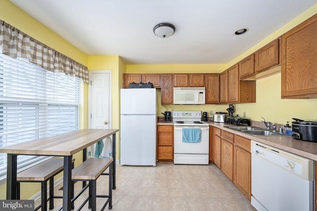 7207 Finch Ln, Fredericksburg, VA 22407 - kitchen featuring white appliances, a sink, and brown cabinets