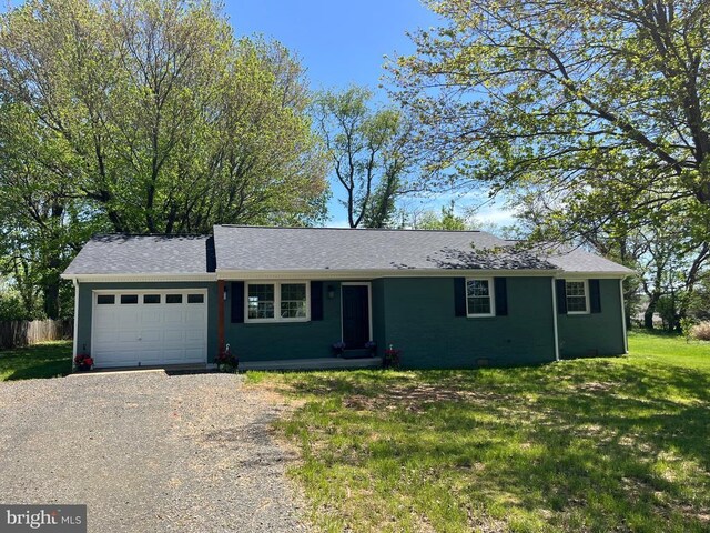 377 Cleveland St, Warrenton, VA 20186 - ranch-style home with an attached garage and gravel driveway