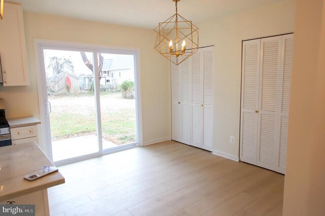 377 Cleveland St, Warrenton, VA 20186 - unfurnished dining area with a chandelier and light wood finished floors