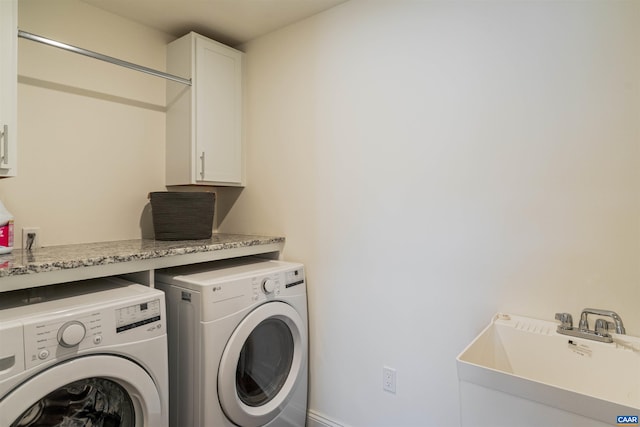 4017 Marie Curie Ct, Charlottesville, VA 22902 - laundry area featuring washing machine and clothes dryer and cabinet space