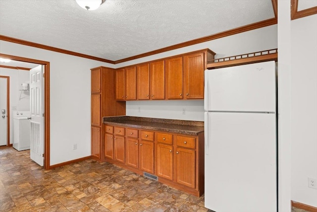 4767 Ox Rd S, Edinburg, VA 22824 - kitchen featuring freestanding refrigerator, brown cabinets, dark countertops, stone finish floors, and a textured ceiling