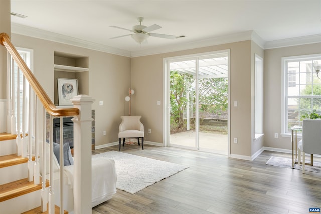 1875 Clay Dr, Crozet, VA 22932 - living area featuring stairway, ornamental molding, healthy amount of natural light, ceiling fan, and wood finished floors